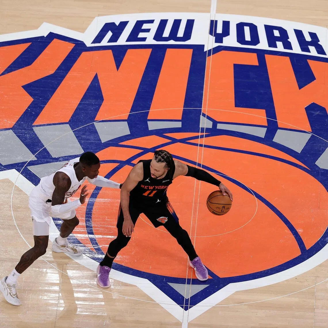 Jalen Brunson of the New York Knicks dribbles the ball against Dennis Schroder of the Cleveland Cavaliers during the fourth quarter in Game 2.