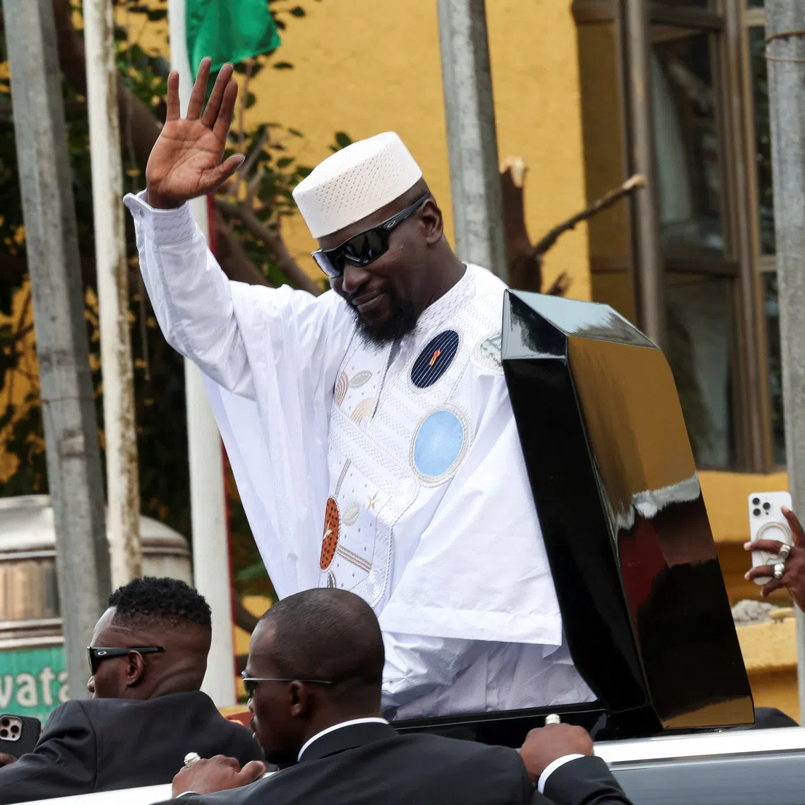 Guinean leader Mamadi Doumbouya waves after submitting his candidacy at the Supreme Court ahead of the presidential election scheduled for December 28, in Conakry, Guinea, November 3, 2025. REUTERS/Luc Gnago