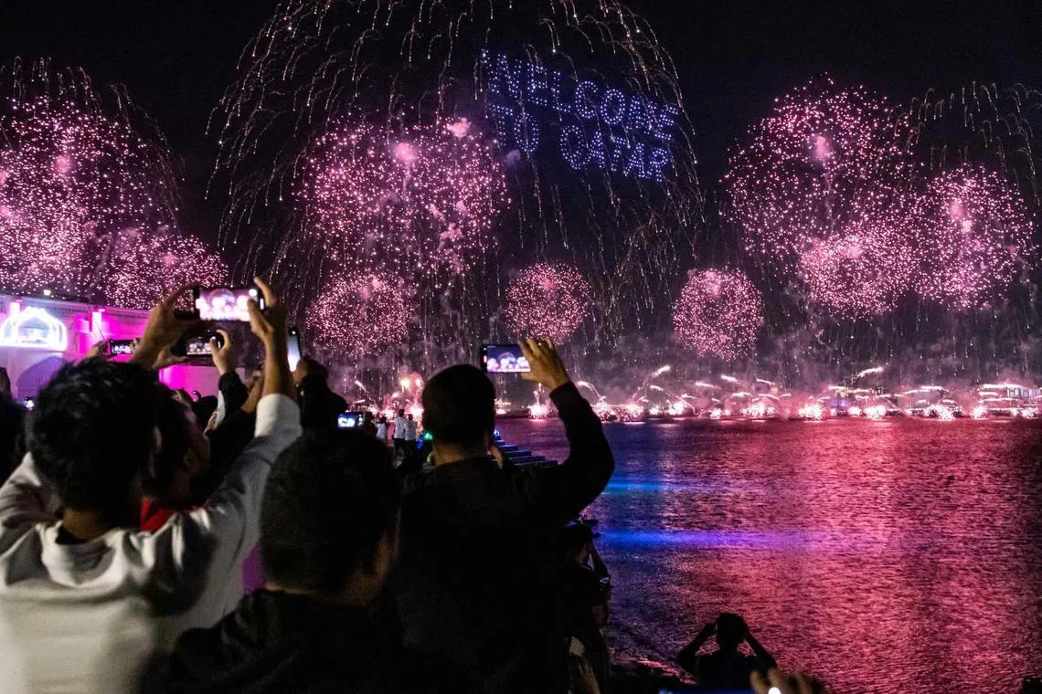 Fireworks explode in the sky in Doha on Nov 20, 2022, during the opening day of the Qatar 2022 World Cup football tournament. 