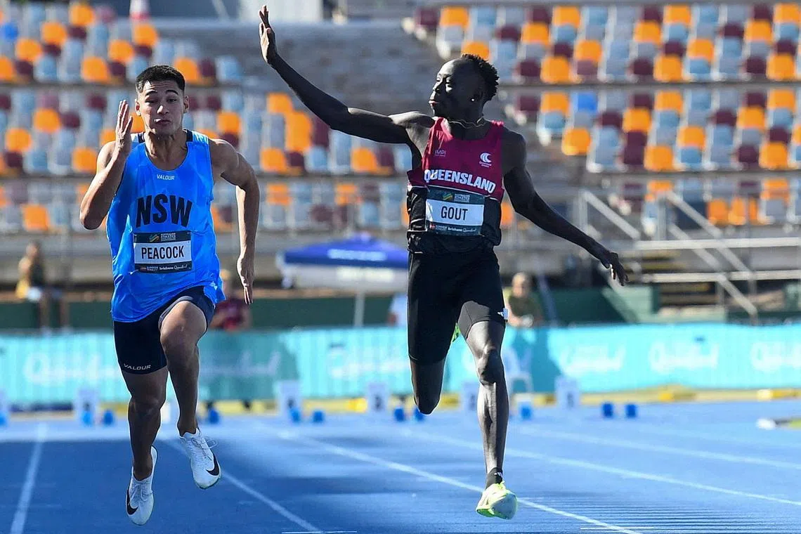 FILE PHOTO: Athletics - Australian Athletics Junior Championship - Brisbane, Australia - April 18, 2026 Gout Gout waves while winning the under 20s 100m final Jono Searle/AAP Image via REUTERS/ File Photo