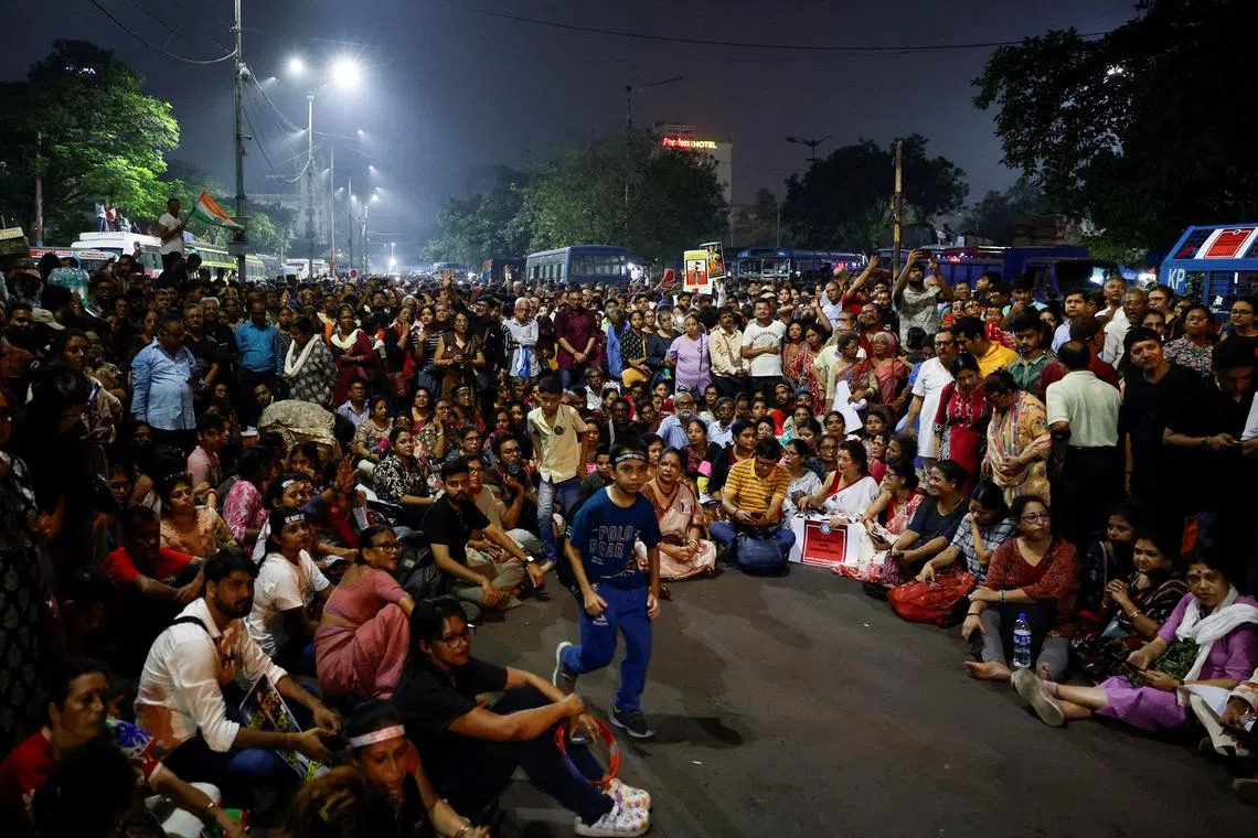 FILE PHOTO: People sit and chant slogans as they attend a protest condemning the rape and murder of a trainee medic at a government-run hospital, in Kolkata, India, October 15, 2024. REUTERS/Sahiba Chawdhary/File Photo