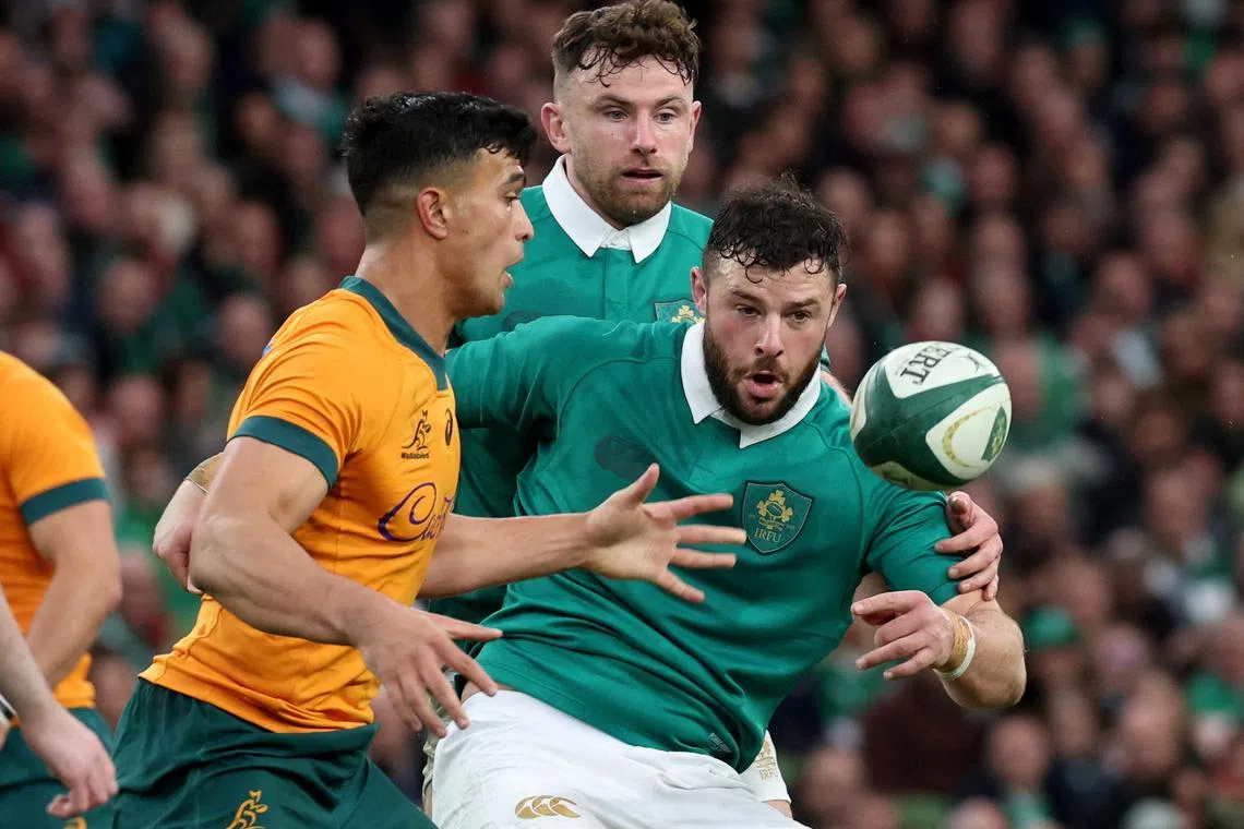 FILE PHOTO: Rugby Union - Autumn Internationals - Ireland v Australia - Aviva Stadium, Dublin, Ireland - Nov. 30, 2024 Australia's Joseph-Aukuso Suaalii in action with Ireland's Robbie Henshaw REUTERS/Lorraine O'sullivan/File Photo