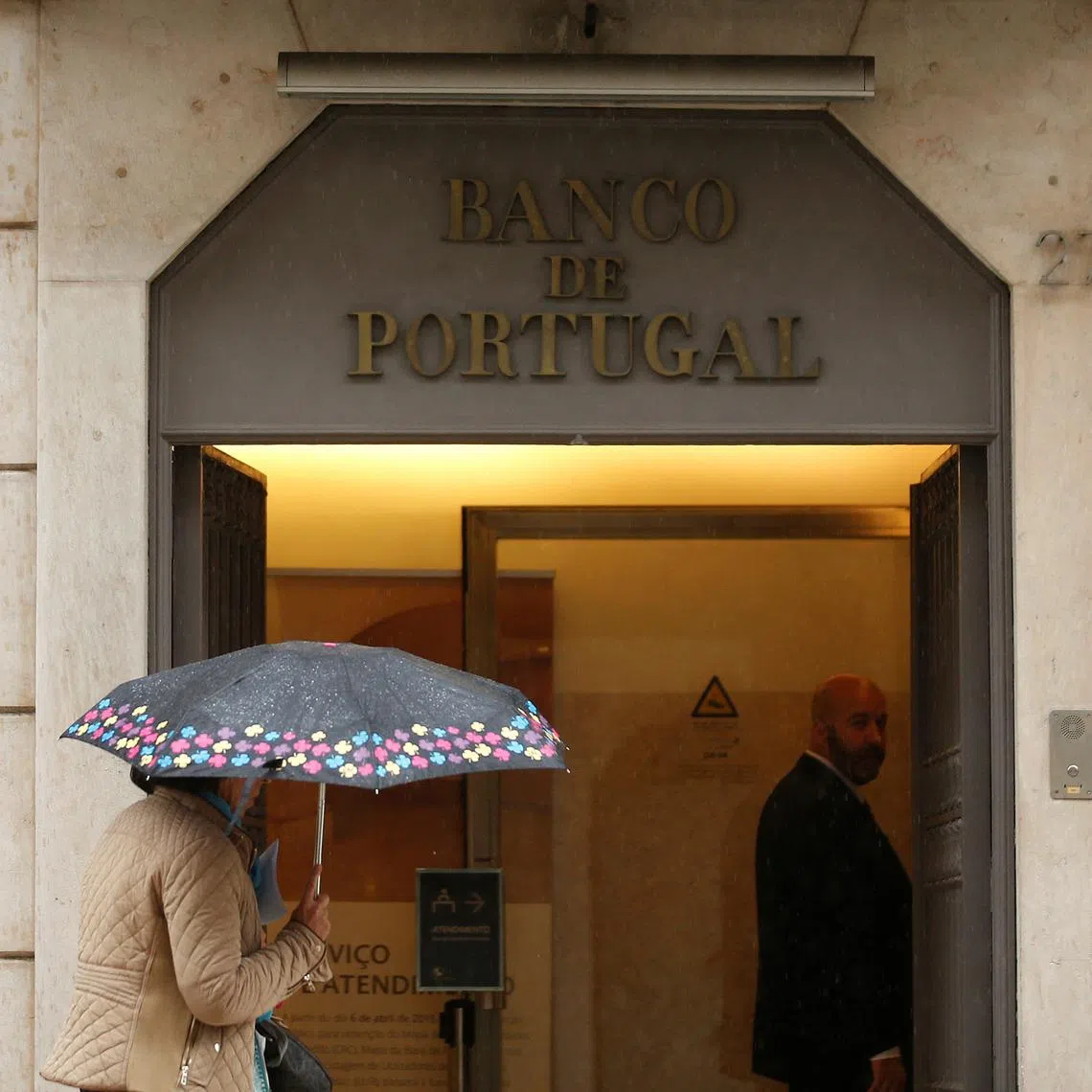 FILE PHOTO: A woman walks outside Bank of Portugal  in downtown Lisbon, Portugal, May 11, 2016.  REUTERS/Rafael Marchante/File Photo