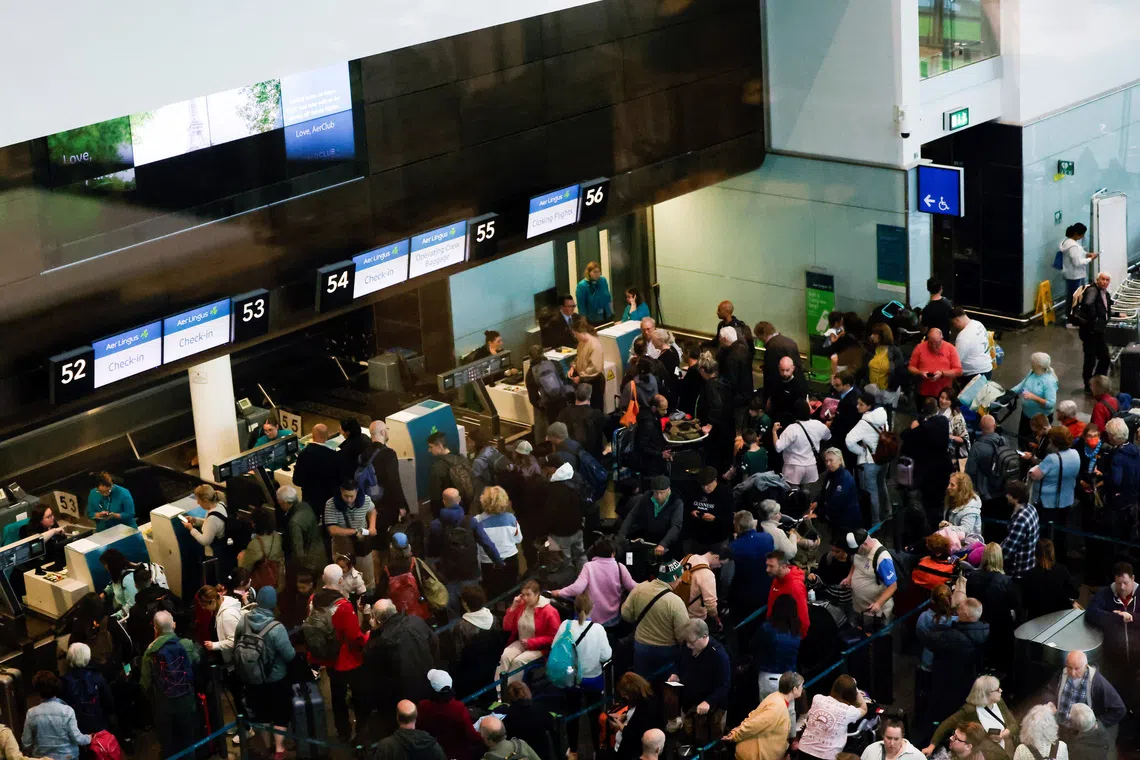 People queue inside Terminal 2 at Dublin Airport, following its reopening after it was evacuated as a safety precaution, in Dublin, Ireland, September 20, 2025. REUTERS/Clodagh Kilcoyne