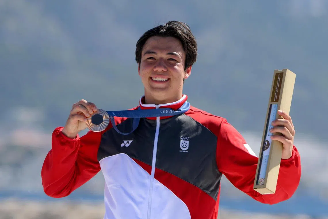 Singaporean Kitefoiler Maximilian Maeder with his bronze medal of the Paris 2024 Olympics Men’s Kite event at the Marseille Marina on August 9, 2024.