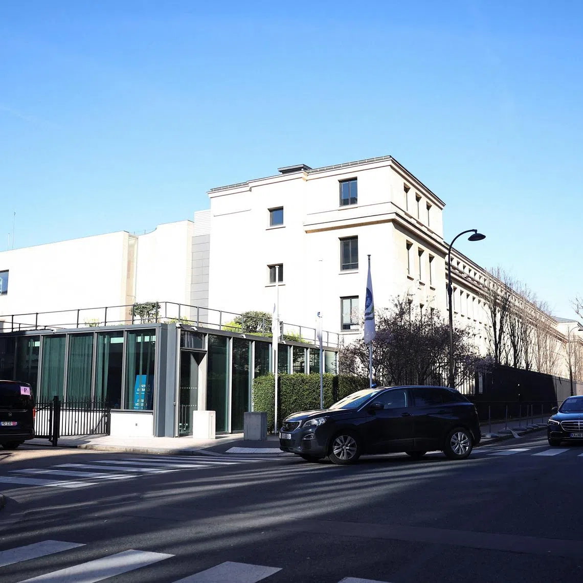 A Chinese delegation arrives at the Organisation for Economic Co-operation and Development (OECD) headquarters for trade talks with a U.S. delegation, in Paris, France, March 15, 2026. REUTERS/Abdul Saboor
