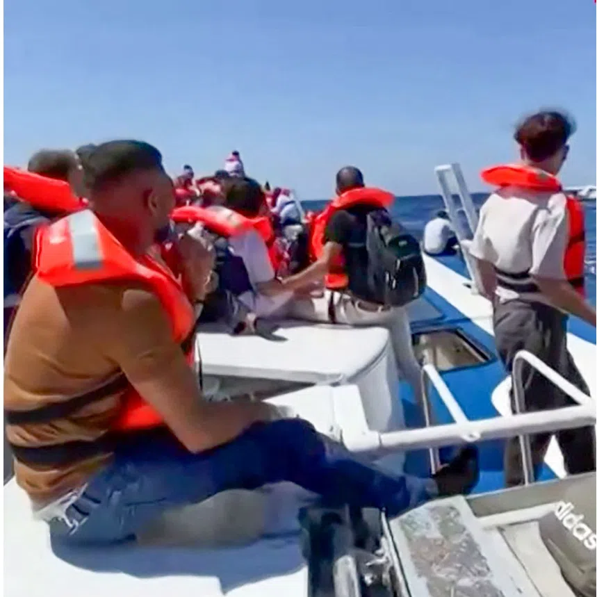 Passengers waiting to be rescued at sea following the sinking of the ferry they were travelling on capsized off north Cyprus.