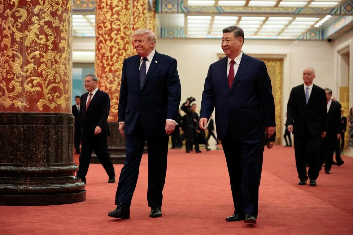 US President Donald Trump (left) and Chinese President Xi Jinping arriving for a state banquet at the Great Hall of the People in Beijing, China, on May 14.