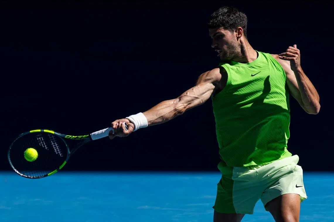 Jan 23, 2026; Melbourne, Victoria, Australia; Carlos Alcaraz of Spain in action against Corentin Moutet of France in the third round of the men’s singles at the Australian Open at Rod Laver Arena in Melbourne Park. Mandatory Credit: Mike Frey-Imagn Images