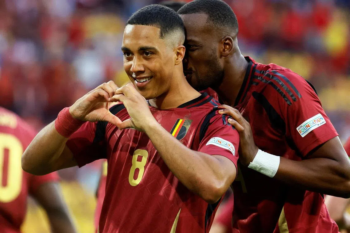 Belgium's Youri Tielemans celebrates scoring their first goal.
