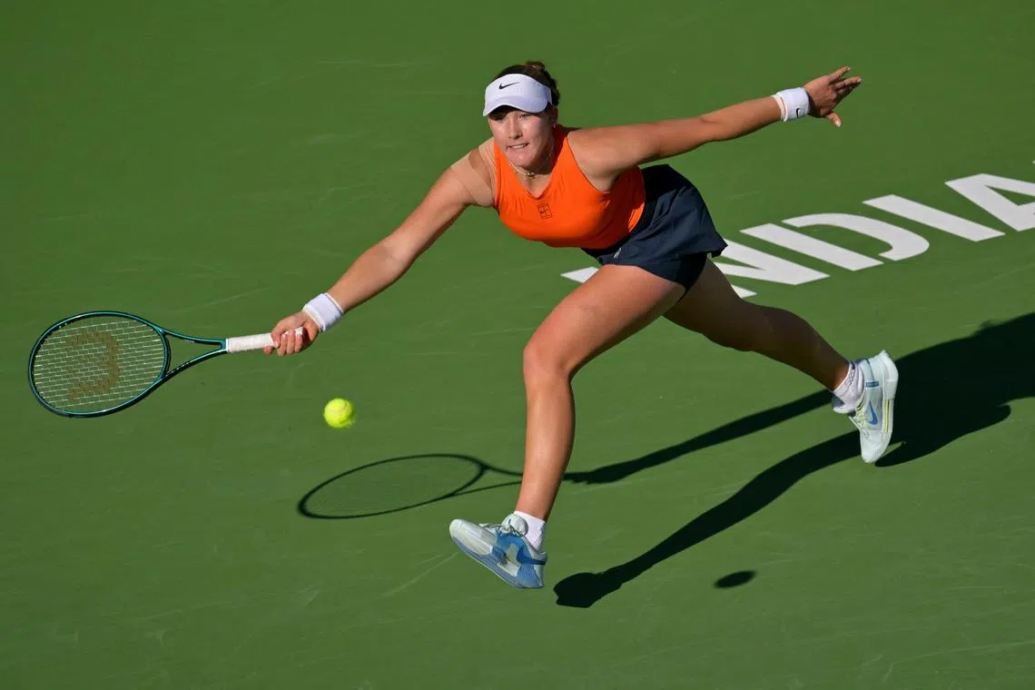 Mirra Andreeva hitting a shot during her Indian Wells semi-final clash with Iga Swiatek.
