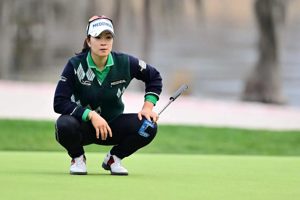 Leader Kim A-lim of South Korea lining up a putt on the 18th green during the third round of the Tournament of Champions 2025 at Lake Nona Golf & Country Club on February 01, 2025 in Orlando, Florida.   Julio Aguilar/Getty Images/AFP (Photo by Julio Aguilar / GETTY IMAGES NORTH AMERICA / Getty Images via AFP)