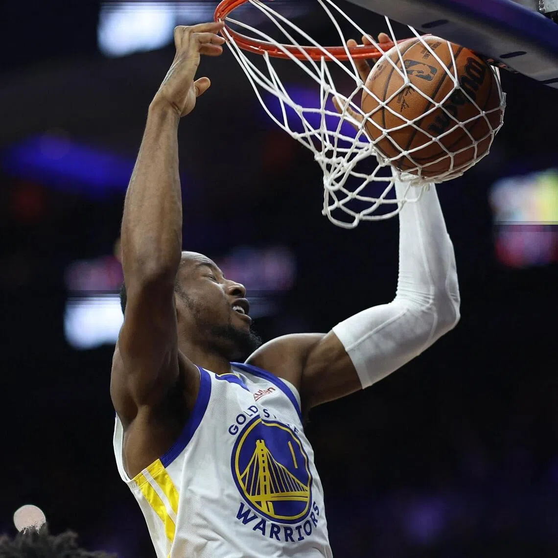 Golden State Warriors forward Jonathan Kuminga dunks the ball against the Philadelphia 76ers during the third quarter at Xfinity Mobile Arena. 