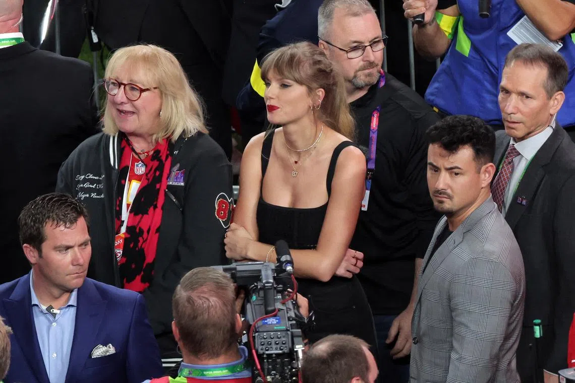 Football - NFL - Super Bowl LVIII - Kansas City Chiefs v San Francisco 49ers - Allegiant Stadium, Las Vegas, Nevada, United States - February 11, 2024 Recording artist Taylor Swift stands with the mother of Kansas City Chiefs' Travis Kelce, Donna Kelce after Kansas City Chiefs win Super Bowl LVIII REUTERS/Carlos Barria