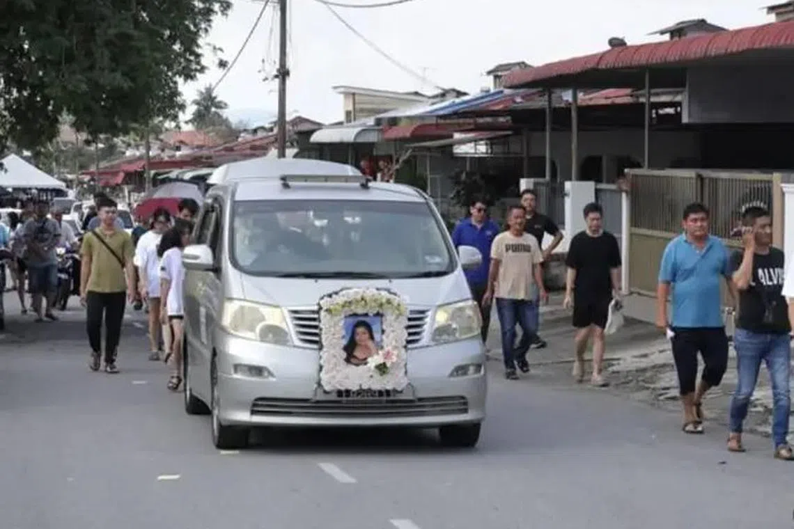 Family and friends sending off the hearse carrying the body of Ms Lee Zi Rou in Penang on Nov 17.