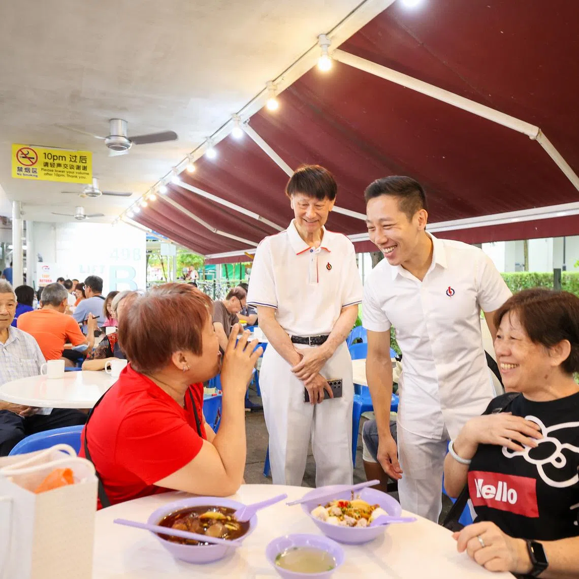 Jurong GRC MP Xie Yao Quan (second from right) chatting with residents during his walkabout in Jurong Central Plaza on March 23.
