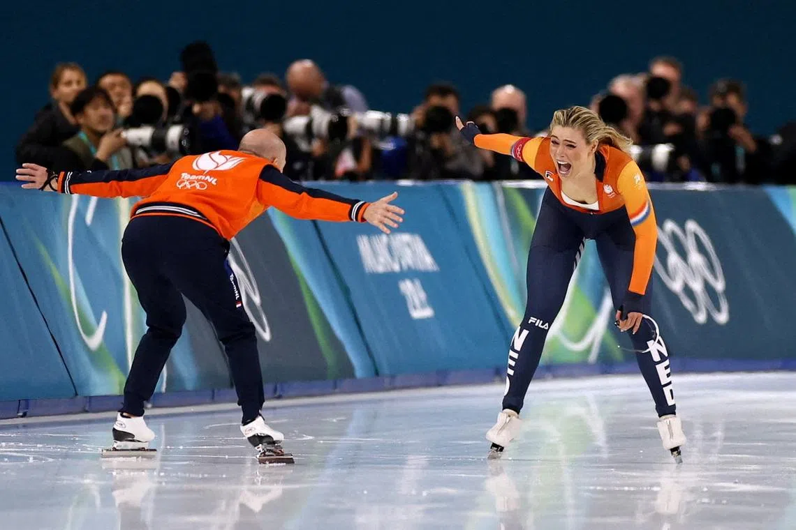 Milano Cortina 2026 Olympics - Speed Skating - Women's 1000m - Milano Speed Skating Stadium, Milan, Italy - February 09, 2026. Jutta Leerdam of Netherlands celebrates her Olympic record time and winning the women's 1000m race with her coach Kosta Poltavets. REUTERS/Yves Herman