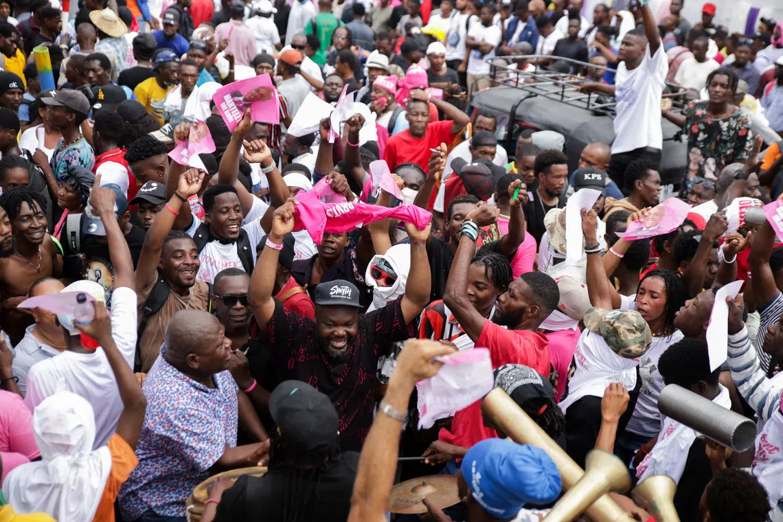 Supporters gather for Haitian former President Michel Martelly as he registers to run for president in the upcoming election, which had been planned for December before the government announced it was reviewing the schedule, in Port-au-Prince, Haiti, October 23, 2026. REUTERS/Fildor Pq Egeder