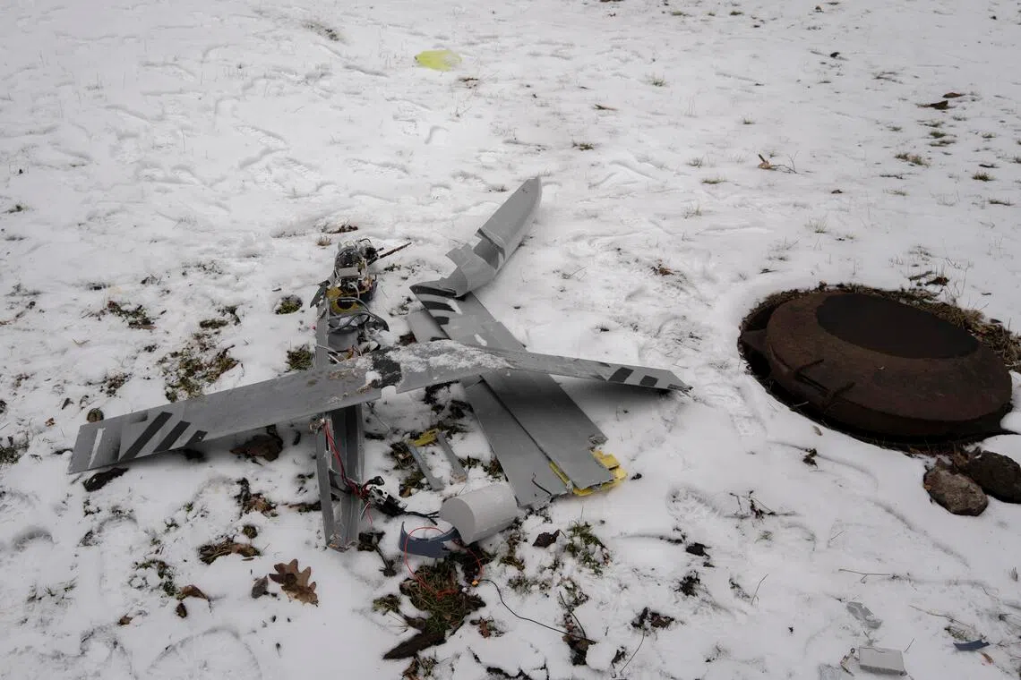 Debris at the site of a Russian drone strike near a supermarket and a fast-food outlet in Kramatorsk, eastern Ukraine, on Feb 23.