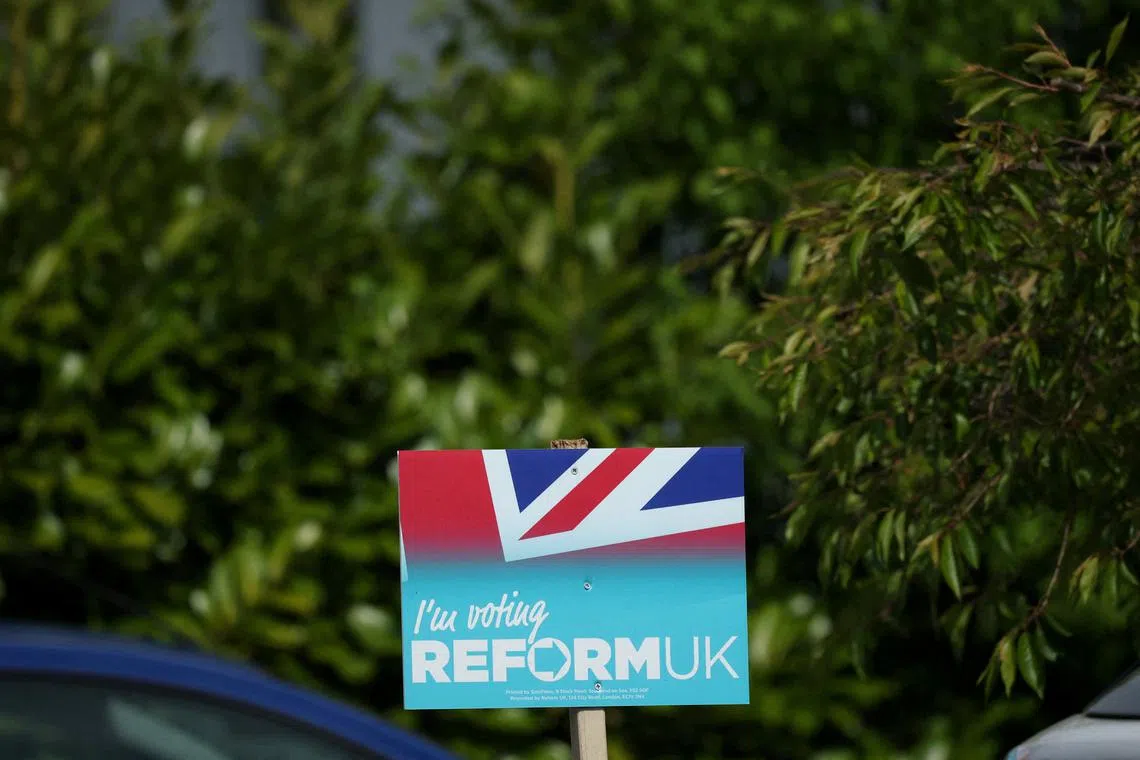 FILE PHOTO: A Reform UK party poster is seen outside a house ahead of the forthcoming Runcorn and Helsby parliamentary by-election in Frodsham, Britain, April 25, 2025. REUTERS/Phil Noble/File Photo