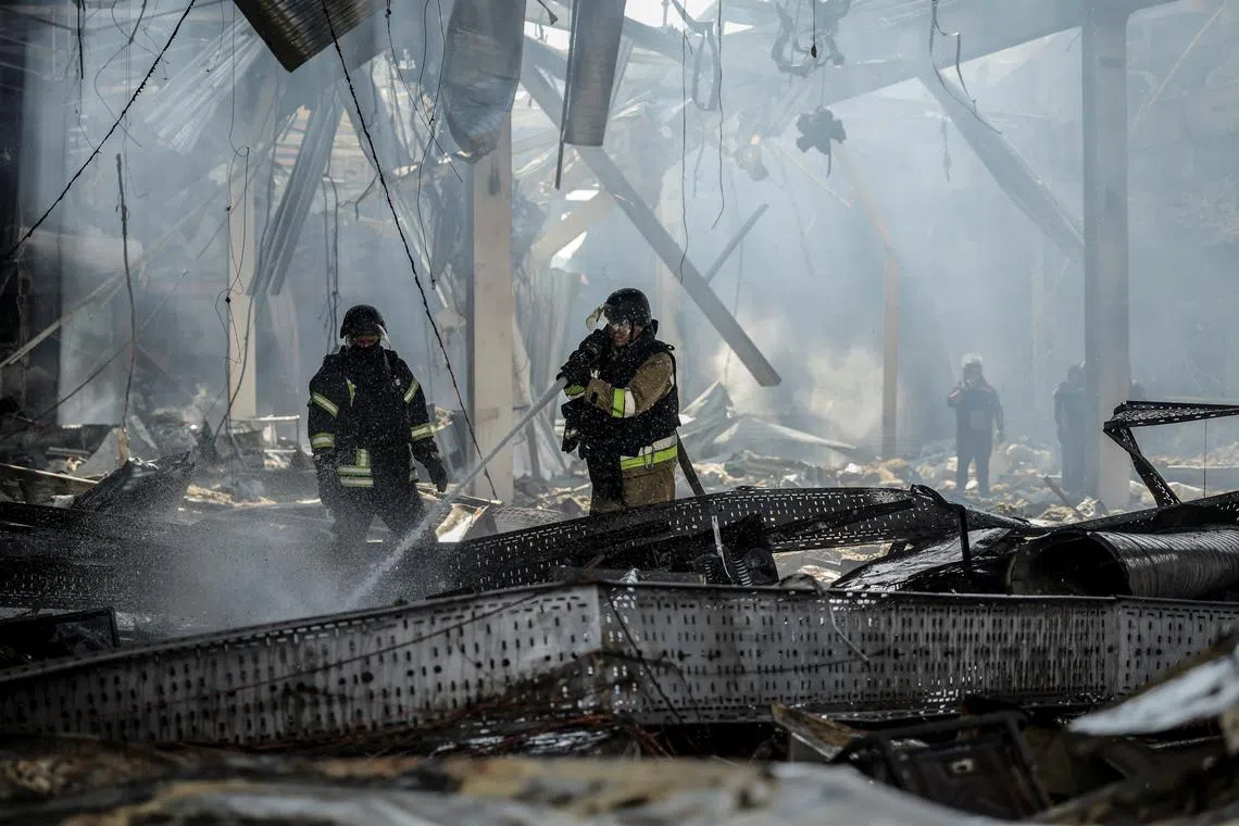 Firefighters work at a site of a supermarket heavily damaged by a Russian military strike, amid Russia's attack on Ukraine, in Kostiantynivka, Donetsk region, Ukraine August 9, 2024. REUTERS/Stringer