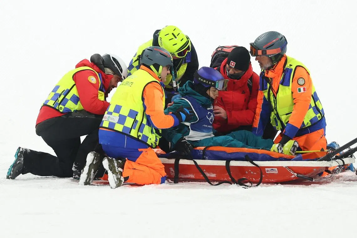 Milano Cortina 2026 Olympics - Freestyle Skiing - Women's Freeski Big Air Final - Livigno Snow Park, Livigno, Italy - February 16, 2026. Mathilde Gremaud of Switzerland is carried on a stretcher after sustaining an injury during the warm up before the final. REUTERS/Hannah Mckay