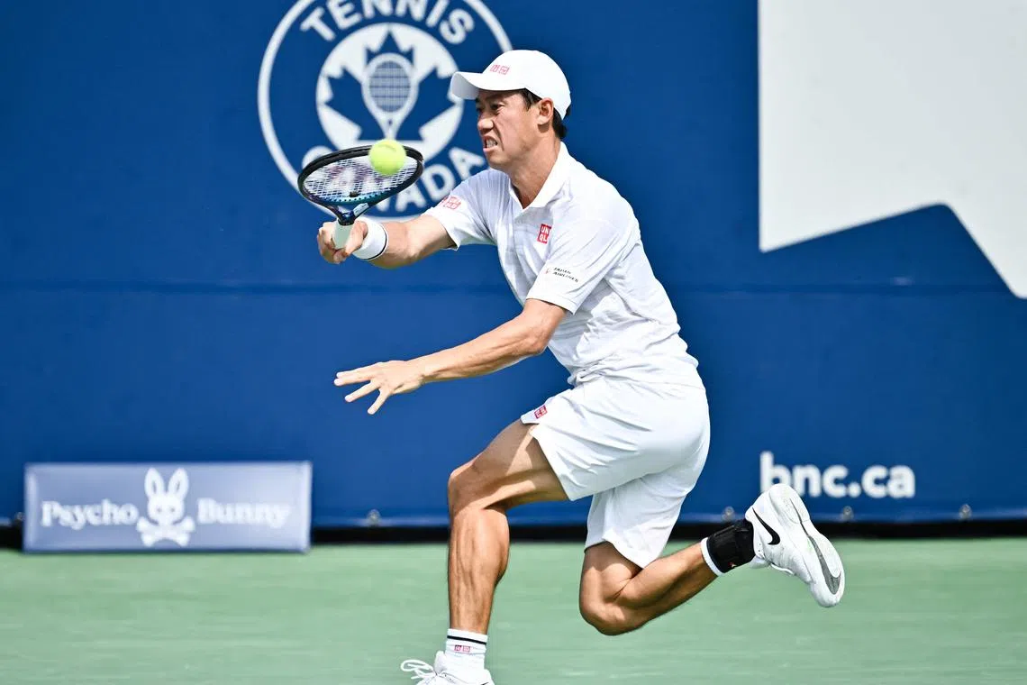 Kei Nishikori of Japan plays a forehand against Stefanos Tsitsipas of Greece in the second round of the Montreal Masters.