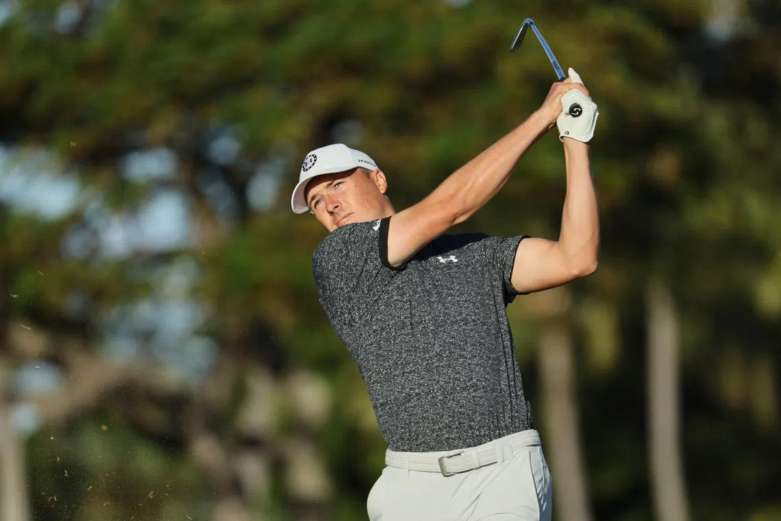 Jordan Spieth plays his shot from the 11th tee during the first round of the Sony Open in Hawaii.