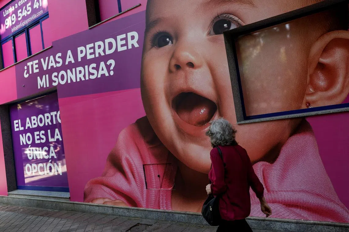 An anti-abortion poster across the street of the private clinic Dator, which provides abortions, in Madrid, Spain.