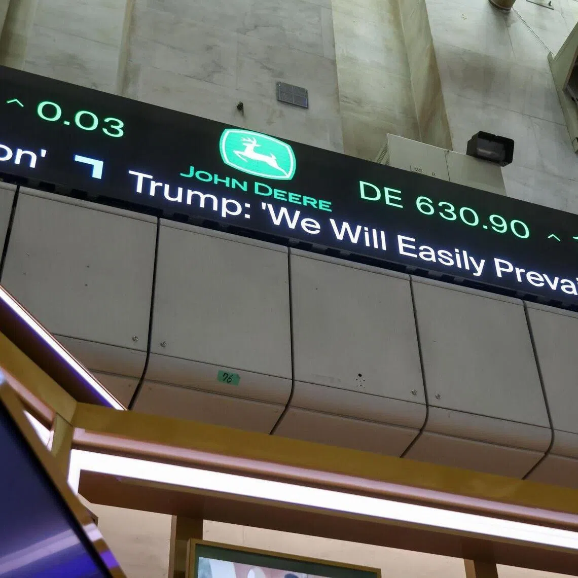 News from US President Donald Trump's speech displayed on the floor of the New York Stock Exchange on March 2, 2026.