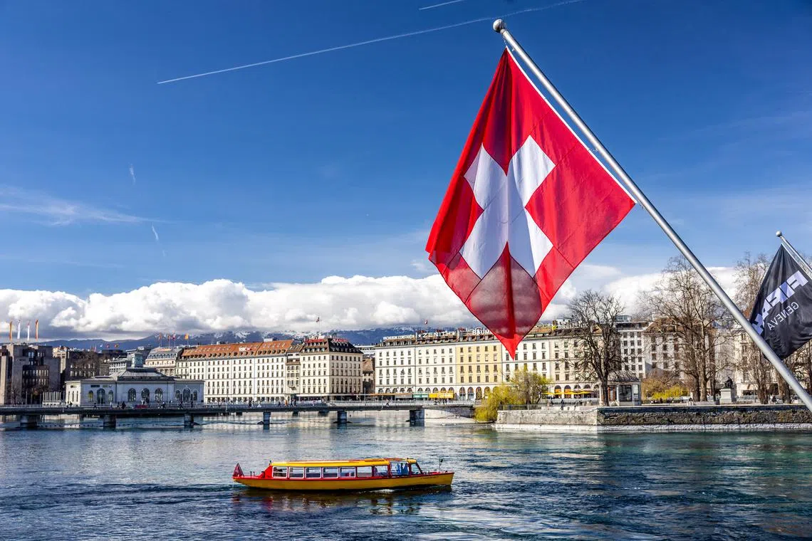 FILE PHOTO: Swiss flag is pictured at the Harbour in Geneva, Switzerland, March 13, 2024. REUTERS/Denis Balibouse/File Photo