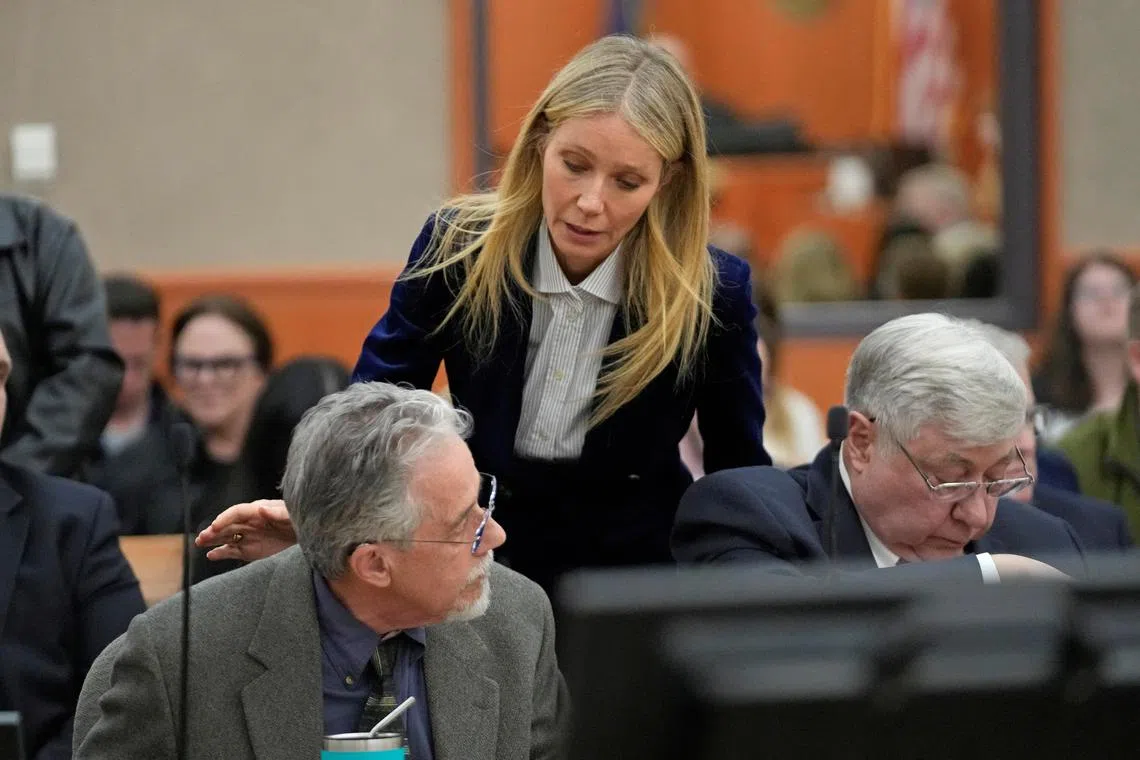 Actor Gwyneth Paltrow, seen speaking to retired optometrist Terry Sanderson, was awarded US$1 in symbolic damages that she had asked for in a countersuit. 