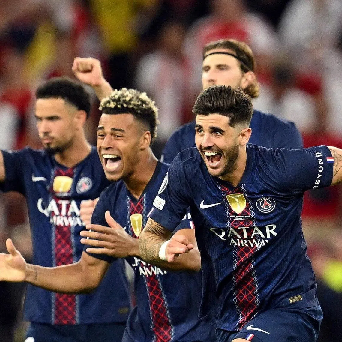 Paris St Germain’s Lucas Beraldo, Desire Doue, Warren Zaire-Emery and Illia Zabarnyi celebrate after winning the Champions League final in May.