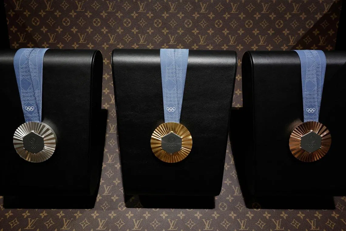 The 2024 Paris Olympic Games medals are displayed inside a custom-designed trunk manufactured by Louis Vuitton.