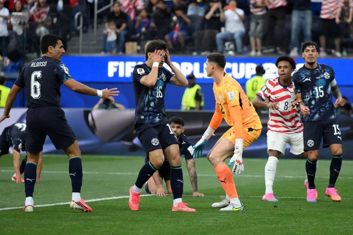 Paraguay’s Damian Bobadilla has his head in his hands after scoring an own goal in the 4-1 loss to the United States.