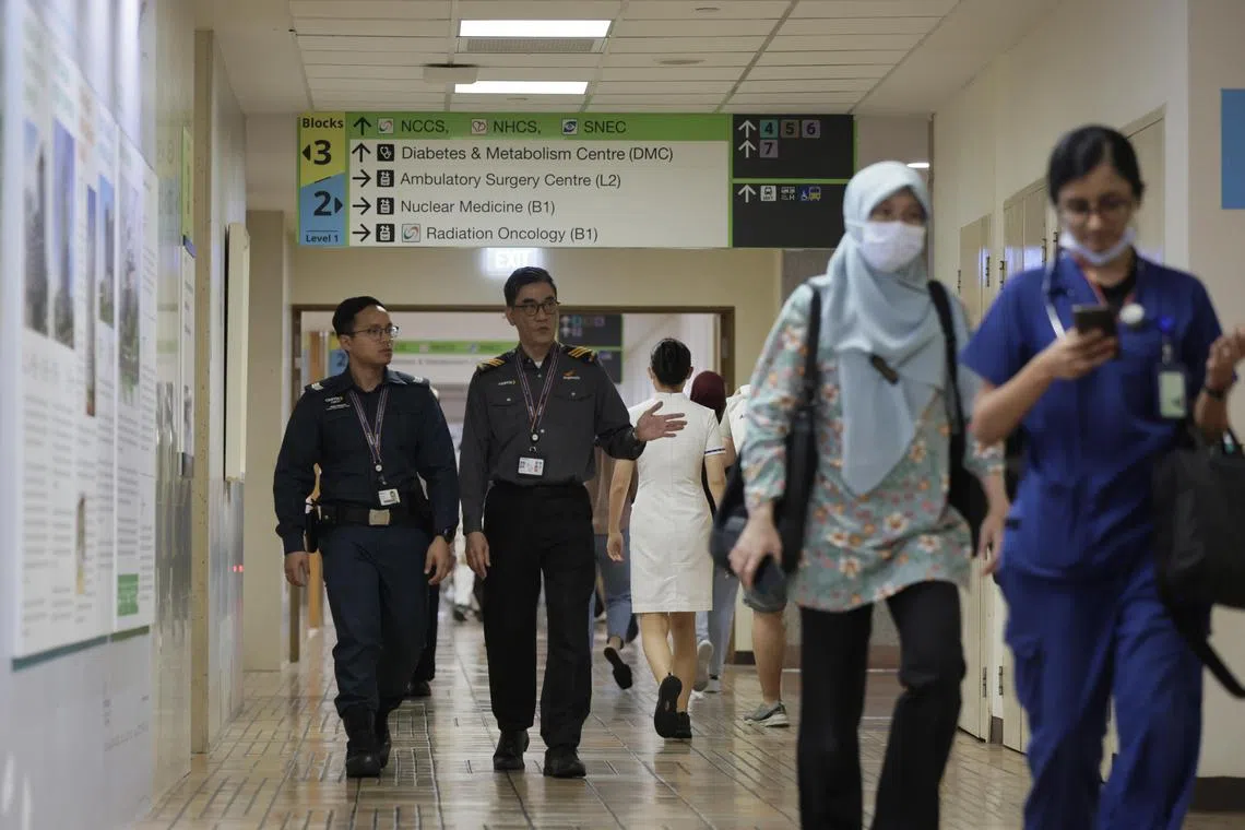 Certis auxilliary police officer, Sgt (APF) Muhammad Redhuan Azmi, 27 and security supervisor Sammy Lee, (right) , 55, are deployed to the Singapore General Hospital to provide security services and keep the peace. There are times they even find themselves at the brunt of the abuse.