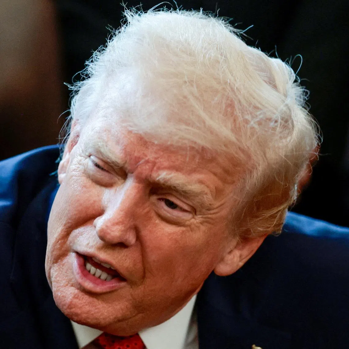 FILE PHOTO: U.S. President Donald Trump speaks in the Oval Office as he signs an executive order, at the White House in Washington, D.C., U.S., December 18, 2025. REUTERS/Evelyn Hockstein/File Photo