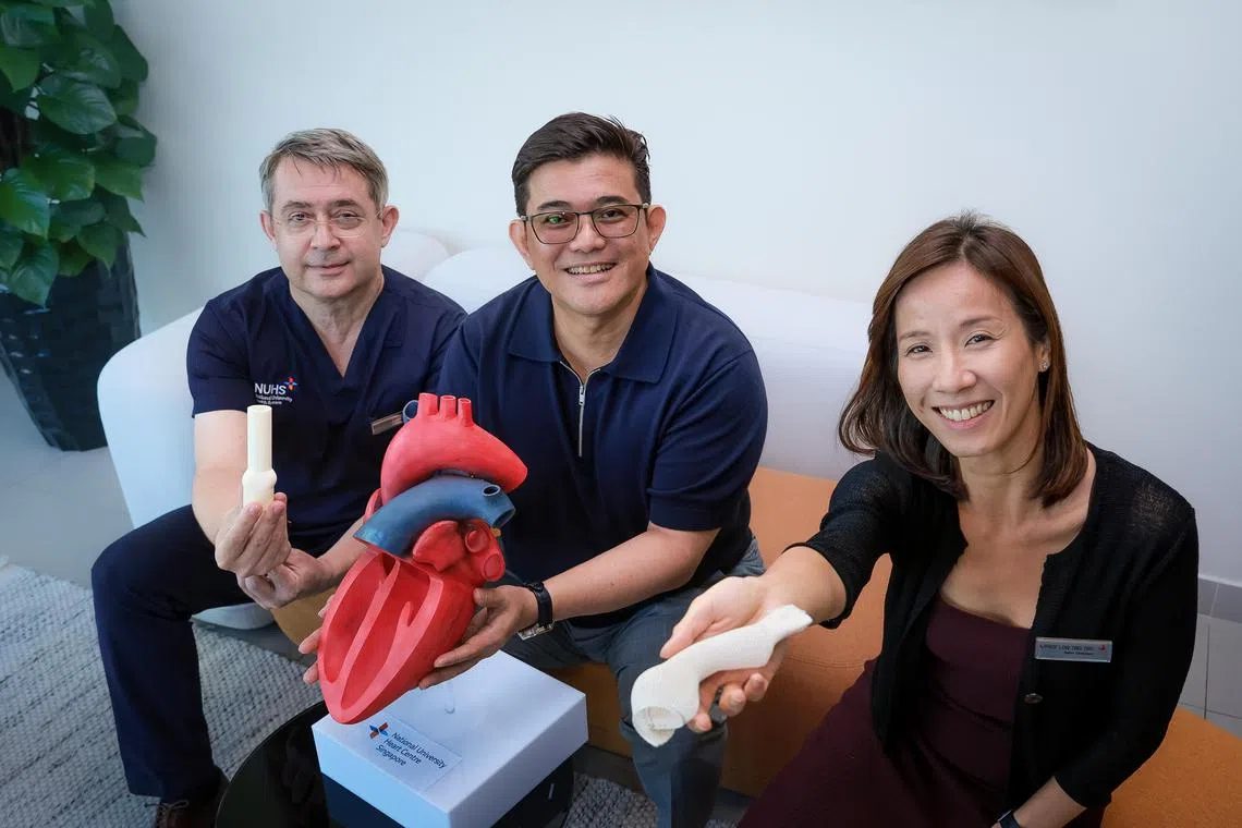 Adjunct Associate Professor Vitaly A. Sorokin (left) and Adjunct Associate Professor Low Ting Ting with Mr Long Foo Pieng, who was among the first few patients to undergo the procedure.