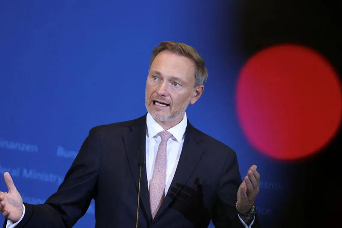 German Finance Minister Christian Lindner is pictured next to the recording light of a TV camera as he presents Germany’s new tax revenue estimates in Berlin, Germany, October 26, 2023.      REUTERS/Liesa Johannssen/File Photo
