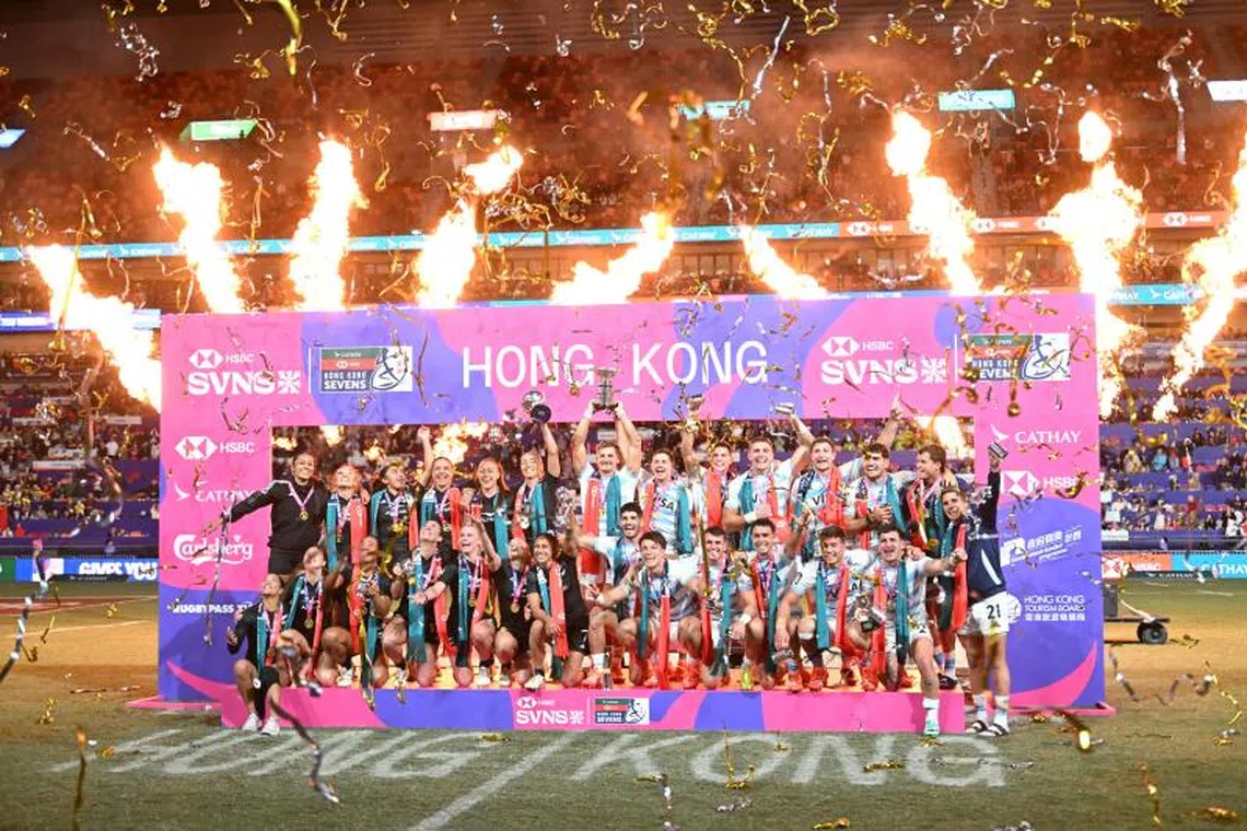 The New Zealand women and Argentina men's teams celebrate after winning their Cup finals of the 2025 Rugby Sevens Hong Kong tournament at the Kai Tak Stadium on March 30.