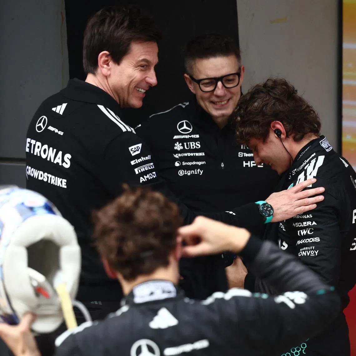 Formula One F1 - Chinese Grand Prix - Shanghai International Circuit, Shanghai, China - March 15, 2026 Mercedes' Andrea Kimi Antonelli celebrates after winning the Chinese Grand Prix with Mercedes team principal Toto Wolff and race engineer Peter Bonnington REUTERS/Jakub Porzycki