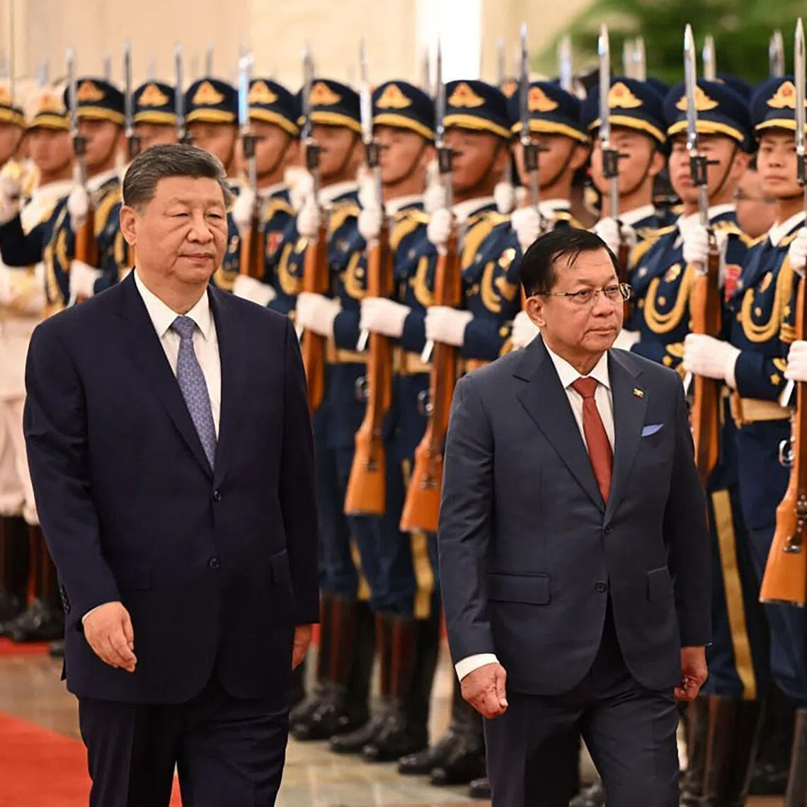 Myanmar's President Min Aung Hlaing (R) and China's President Xi Jinping inspecting a guard of honour during a welcoming ceremony at the Great Hall of the People in Beijing.