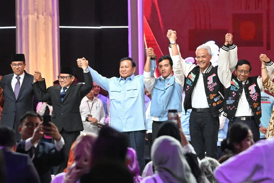 Indonesian presidential candidates Anies Baswedan (left),  Prabowo Subianto (centre) and Ganjar Pranowo (second from right) at a debate on Feb 4.