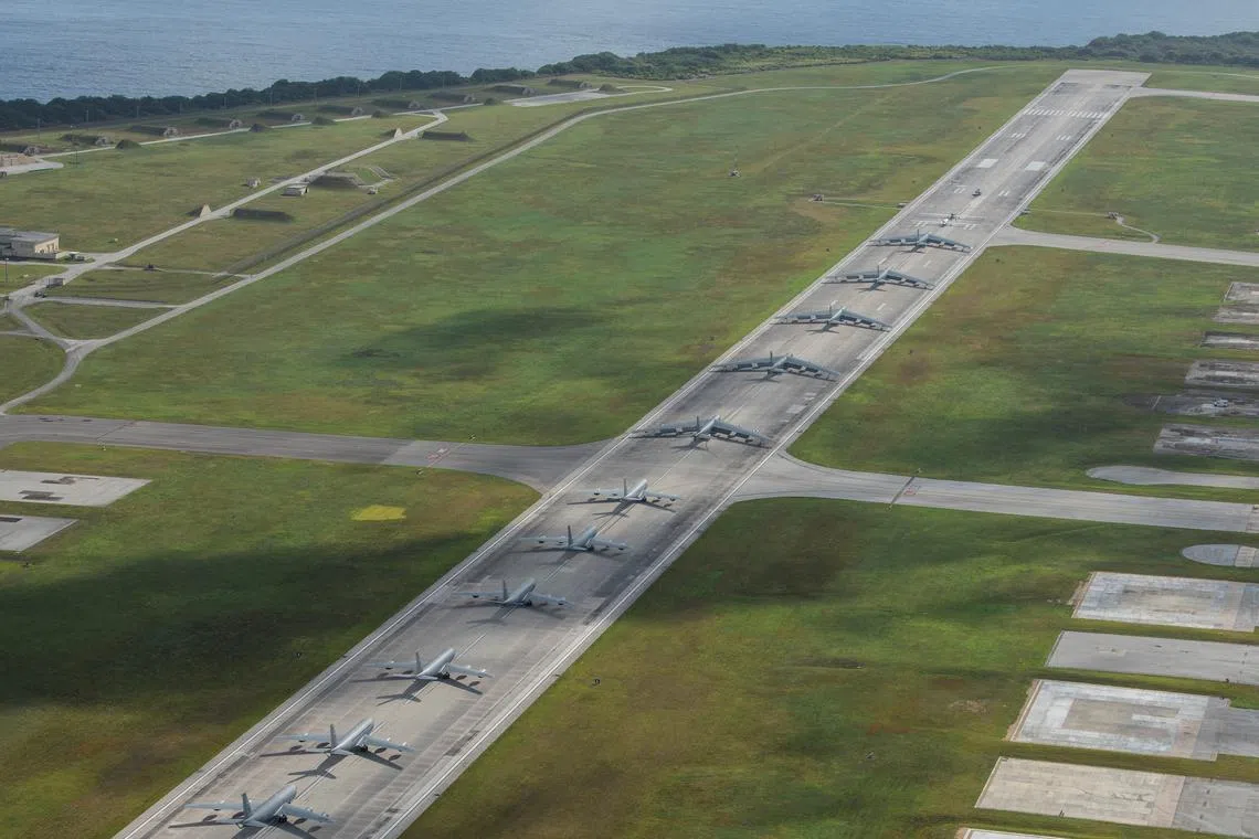 A U.S. Navy MH-60S Knighthawk, U.S. Air Force RQ-4 Global Hawk, Navy MQ-4C Triton, Air Force B-52 Stratofortresses, and KC-135 Stratotankers perform an \"Elephant Walk\" at Andersen Air Force Base, Guam April 13, 2020. Picture taken April 13, 2020. U.S. Air Force/Senior Airman Michael S. Murphy/Handout via REUTERS/File Photo