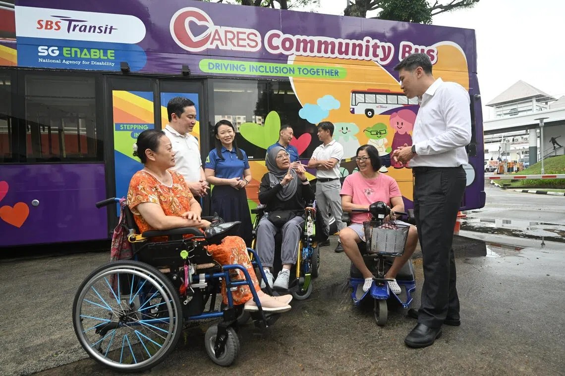 Jeffrey Sim (second left), SBS Transit Group CEO, Lee May Gee (third left), CEO of SG Enable, and Shawn Huang (extreme right), Senior Parliamentary Secretary of Ministry of Manpower, speaking with Jurong residents after the MOU signing between SG Enable and SBST on Oct 29, 2026. ST PHOTO: AZMI ATHNI