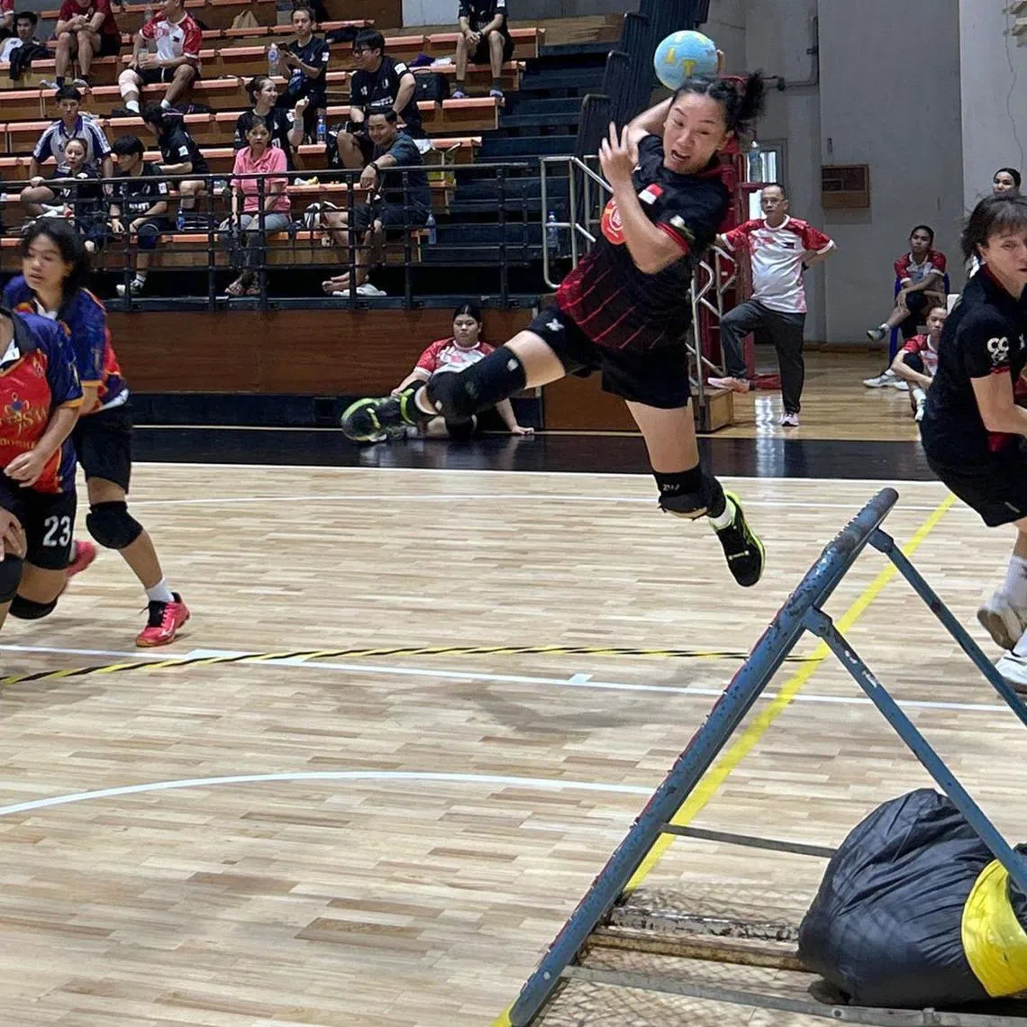 Singapore's Xiao Cheng Xin attempting a shot in the 36-21 win over Thailand A on July 12.