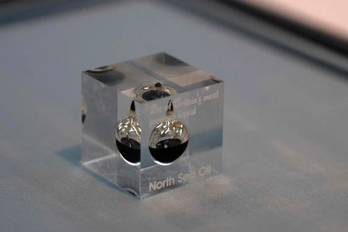 A acrylic paperweight encasing crude oil that forms part of an installation entitled ‘Morale Patch’ by artist Tanoa Sasraku.