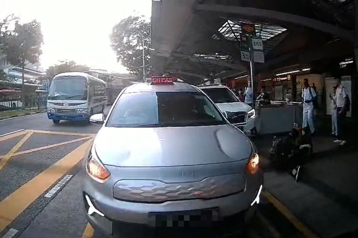 A video uploaded on social media shows a woman getting knocked off her feet after a collision involving a car and a taxi at a taxi stand.