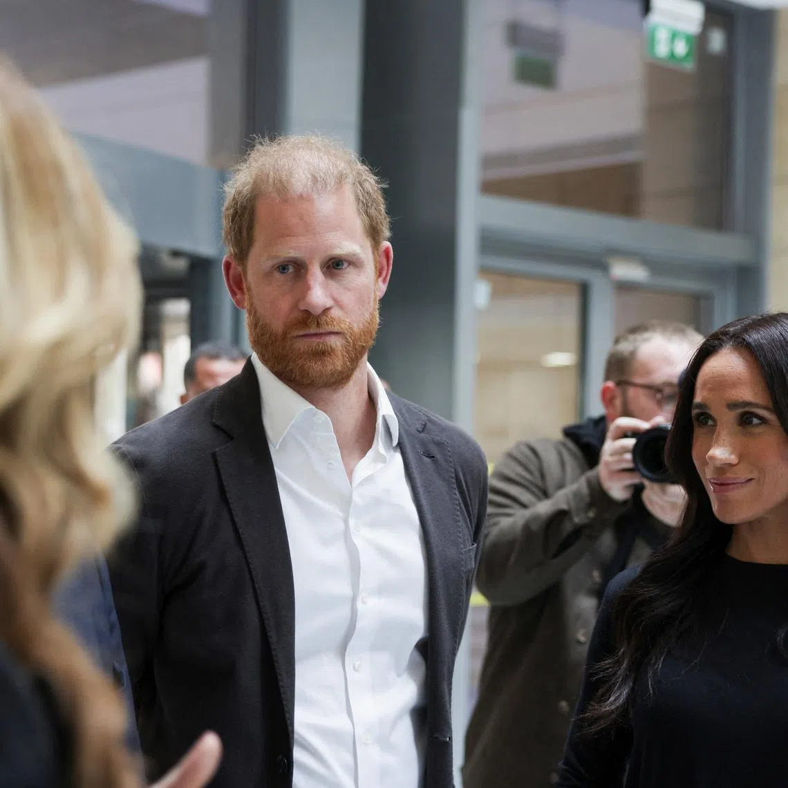 Britain's Prince Harry and Meghan, the Duchess of Sussex, listen as they visit the King Hussein Cancer Center accompanied by a delegation from the World Health Organization in Amman, Jordan, February 26, 2026. REUTERS/Alaa Al Sukhni