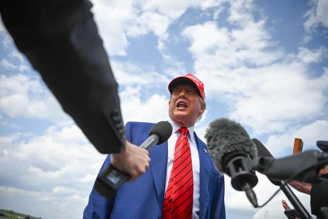 US President Donald Trump speaks to the press upon arrival at Morristown Municipal Airport in Morristown, New Jersey, on June 20, 2025. 